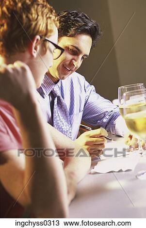 men, women, looking, writing, tilt, restaurant, smile View Large Photo Image Stock Image - men, women, looking, writing, tilt, restaurant, smile. Fotosearch