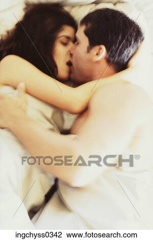 Stock Image - men, women, lying, togetherness, activity, hold, indoors. Fotosearch