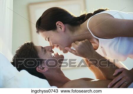 men, women, touching, love, clothing, paint, lying down View Large Photo Image Stock Image - men, women, touching, love, clothing, paint, lying down. Fotosearch