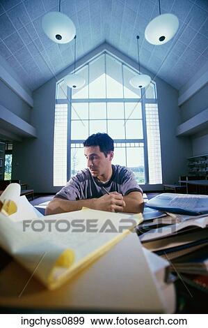 Stock Photo - pen, American, front, hold, shoulders, efficiency, worried. Fotosearch
