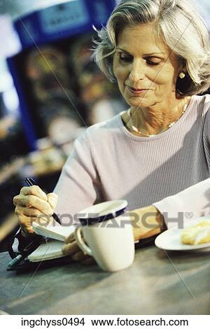 Picture - pen, woman, happiness, casual, activity, hold, shoulders. Fotosearch