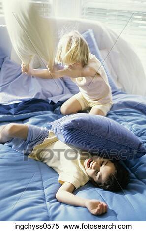 Stock Photography - people, black, lying down, happiness, casual, bedroom, enjoyment. Fotosearch