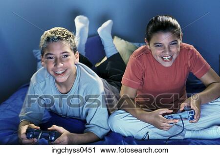 people, smiling, clothing, leisure, casual, enjoyment, lying View Large Photo Image Stock Image - people, smiling, clothing, leisure, casual, enjoyment, lying. Fotosearch