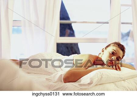 people, windows, woman, pillow, bed, relaxing View Large Photo Image Stock Image - people, windows, woman, pillow, bed, relaxing. Fotosearch