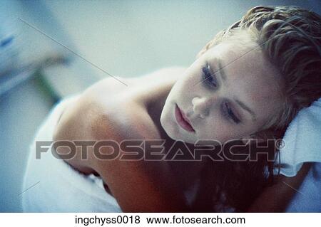 Stock Photo - people, woman, hair, leaning, towel, bath. Fotosearch