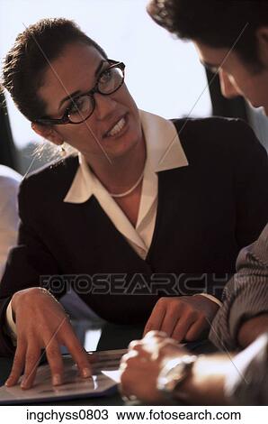 people, woman, suit, talking, eyeglasses, conversation, explaining View Large Photo Image Stock Image - people, woman, suit, talking, eyeglasses, conversation, explaining. Fotosearch