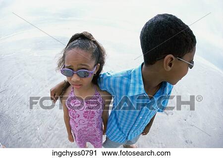 sand, people, boys, girls, clothing, collar, casual View Large Photo Image Stock Image - sand, people, boys, girls, clothing, collar, casual. Fotosearch