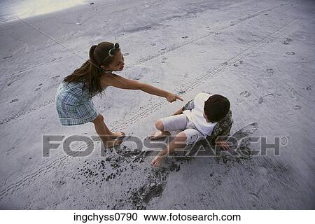 sand, people, clothing, casual, togetherness, cloth, fallen View Large Photo Image Stock Image - sand, people, clothing, casual, togetherness, cloth, fallen. Fotosearch