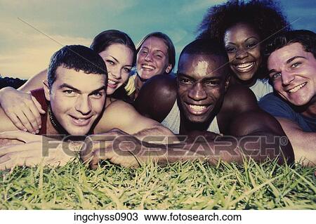 sky, grass, lying down, happiness, casual, lying, togetherness View Large Photo Image Stock Image - sky, grass, lying down, happiness, casual, lying, togetherness. Fotosearch