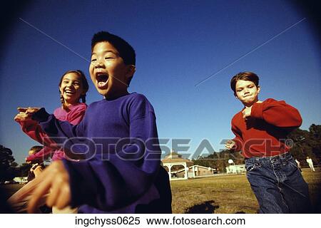 sky, group, children, holding hands, boys, background, fun View Large Photo Image Stock Photography - sky, group, children, holding hands, boys, background, fun. Fotosearch