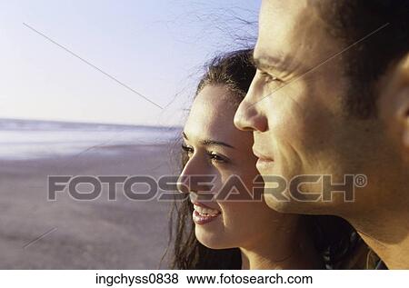 Stock Photo - sky, men, brown hair, toothy, adults, Toothy Smile, Two People. Fotosearch