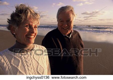 Stock Photograph - sky, men, clothing, leisure, horizon, warm, happiness. Fotosearch