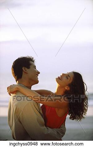 sky, men, embracing, stand, romance, love, embrace View Large Photo Image Stock Photo - sky, men, embracing, stand, romance, love, embrace. Fotosearch