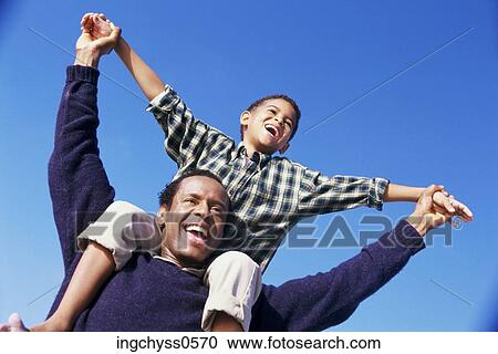 sky, men, holding hands, love, boys, father View Large Photo Image Stock Image - sky, men, holding hands, love, boys, father. Fotosearch