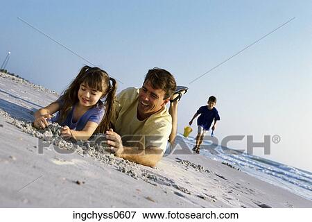 sky, men, tilt, smile, family, child, children View Large Photo Image Stock Photo - sky, men, tilt, smile, family, child, children. Fotosearch