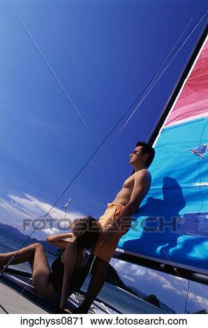 sky, men, tilt, stand, sailboat, leisure, togetherness View Large Photo Image Stock Image - sky, men, tilt, stand, sailboat, leisure, togetherness. Fotosearch
