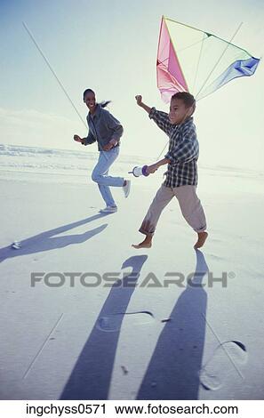 sky, sand, child, pants, barefoot, play View Large Photo Image Stock Image - sky, sand, child, pants, barefoot, play. Fotosearch