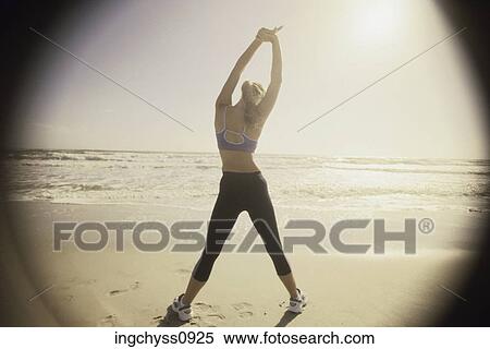 sky, sand, exercising, clothing, footprint, horizon, wave View Large Photo Image Stock Photography - sky, sand, exercising, clothing, footprint, horizon, wave. Fotosearch
