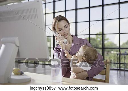 Stock Photo - tree, women, family, child, blond, girls, looking down. Fotosearch