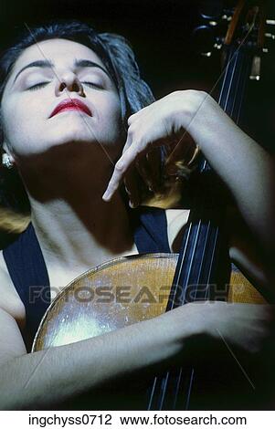 woman, black, Caucasian, years, musical instrument, angle, Low View Large Photo Image Stock Image - woman, black, Caucasian, years, musical instrument, angle, Low. Fotosearch