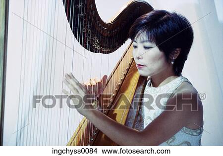 woman, black, hold, musical, performance, shoulders, indoors View Large Photo Image Picture - woman, black, hold, musical, performance, shoulders, indoors. Fotosearch