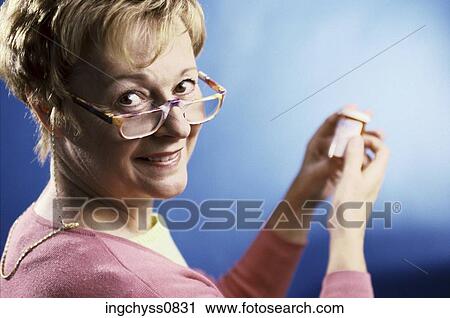 Stock Image - woman, smiling, side, colored, healthcare, Caucasian, look. Fotosearch