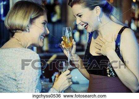 Stock Photograph - women, people, smile, alcohol, short, stand. Fotosearch