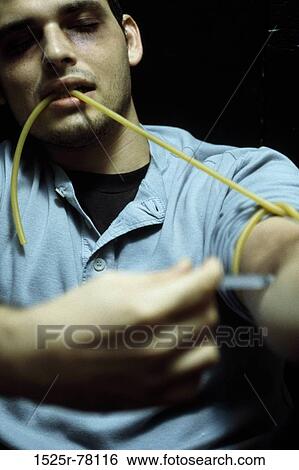 Stock Photograph - blur, injection, vice, indoors, addiction. Fotosearch