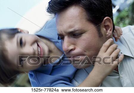 Boy riding piggyback on his father View Large Photo Image Stock Image - Boy riding piggyback on his father. Fotosearch