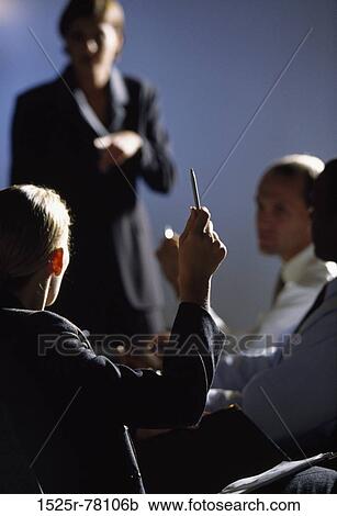 Businesswoman with three businessmen talking in an office View Large Photo Image Stock Image - Businesswoman with three businessmen talking in an office. Fotosearch