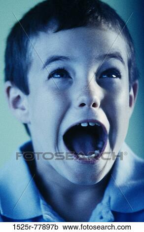 Close-up of a boy screaming View Large Photo Image Stock Image - Close-up of a boy screaming. Fotosearch