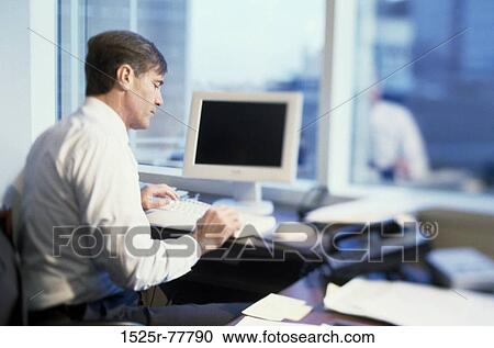 desk, computer, business, Middle-aged, brunette View Large Photo Image Stock Image - desk, computer, business, Middle-aged, brunette. Fotosearch