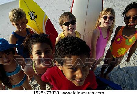 Stock Photo - group, multiethnic, people, water, smiling, beach. Fotosearch