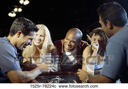 Group of people in a bar View Large Photo Image Stock Image - Group of people in a bar. Fotosearch