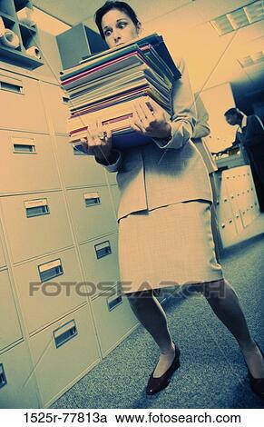 heavy, balance, overwhelmed, business, carrying, folders, brunette View Large Photo Image Stock Image - heavy, balance, overwhelmed, business, carrying, folders, brunette. Fotosearch