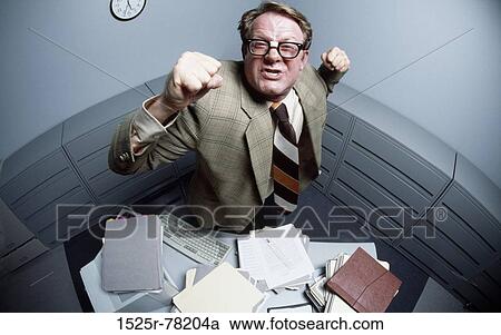 High angle view of a mid adult man with his fist in the air View Large Photo Image Stock Image - High angle view of a mid adult man with his fist in the air. Fotosearch