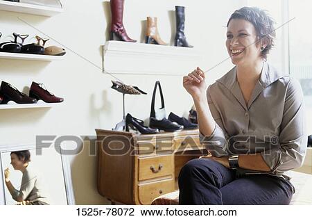 Stock Image - industry, woman, shoes, business, shopping, store. Fotosearch