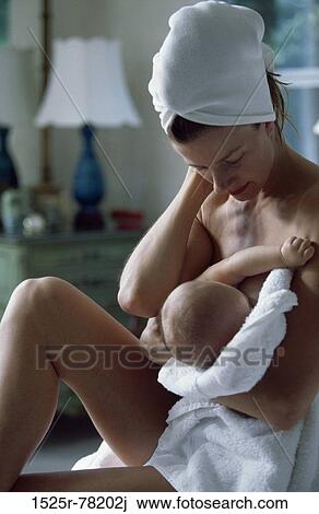 Mother breastfeeding her baby girl View Large Photo Image Stock Image - Mother breastfeeding her baby girl. Fotosearch