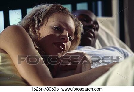 multiethnic, people, home, couple, bed, watch View Large Photo Image Stock Image - multiethnic, people, home, couple, bed, watch. Fotosearch