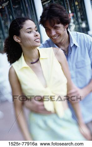multiethnic, people, smiling, couple, holding, outdoors, hugging View Large Photo Image Stock Image - multiethnic, people, smiling, couple, holding, outdoors, hugging. Fotosearch
