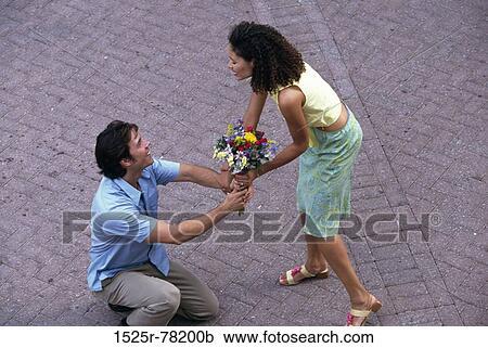 multiethnic, people, smiling, couple, flowers, outdoors View Large Photo Image Stock Image - multiethnic, people, smiling, couple, flowers, outdoors. Fotosearch