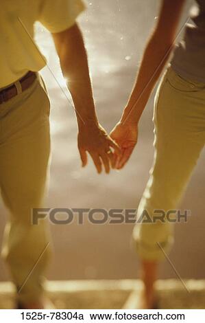 multiethnic, reflection, hands, walking, couple, outdoors, body parts View Large Photo Image Stock Image - multiethnic, reflection, hands, walking, couple, outdoors, body parts. Fotosearch
