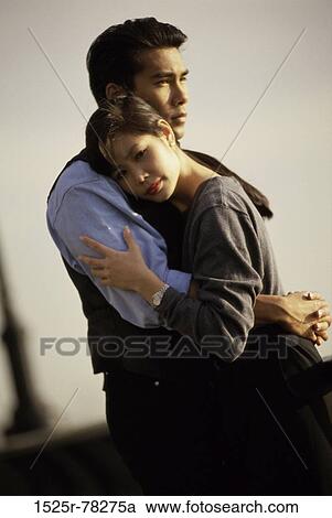 Stock Image - people, Asian, couple, holding, standing, outdoors, romantic. Fotosearch