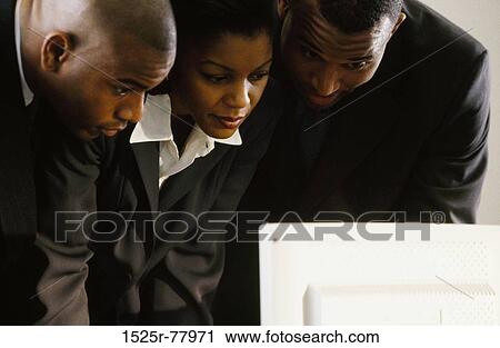 Stock Image - people, computer, business, looking, observing, together. Fotosearch