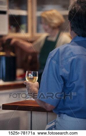 people, couple, wine, drinking, back, Middle-aged, kitchen View Large Photo Image Stock Image - people, couple, wine, drinking, back, Middle-aged, kitchen. Fotosearch