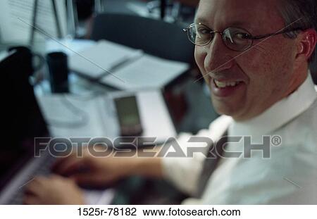 people, desk, eyeglasses, computer, laptop View Large Photo Image Stock Image - people, desk, eyeglasses, computer, laptop. Fotosearch