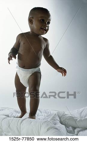 people, diaper, smiling, baby, watch, standing, watching View Large Photo Image Stock Image - people, diaper, smiling, baby, watch, standing, watching. Fotosearch