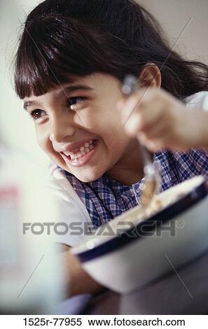 people, eating, smiling, spoon, bowl, happy, holding View Large Photo Image Stock Photography - people, eating, smiling, spoon, bowl, happy, holding. Fotosearch