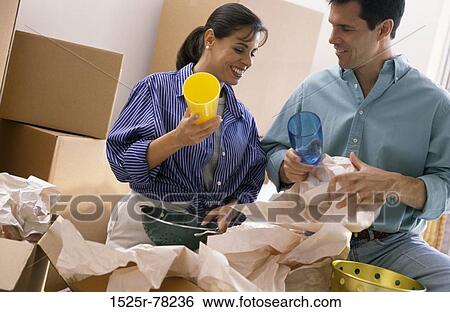 people, home, moving, couple, pack, unwrapping View Large Photo Image Stock Photograph - people, home, moving, couple, pack, unwrapping. Fotosearch