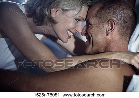 people, home, smiling, staring, couple, bed View Large Photo Image Stock Image - people, home, smiling, staring, couple, bed. Fotosearch